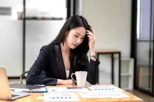 asian-businesswoman-holding-her-head-headache-stressed