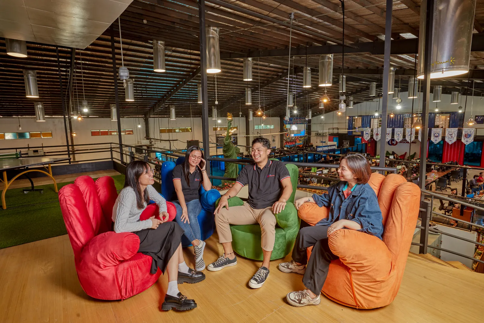 Colleagues talking together in the staff lounge at our Philippines office